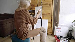 blonde babe in boots spreads legs painting her pretty pussy flower close-up