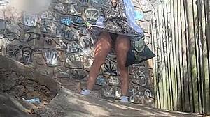 Novinha flashes shaved pussy publicly on beach in tiny thong bikini