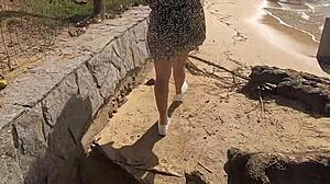 Novinha flashes shaved pussy publicly on beach in tiny thong bikini