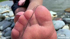 goddess teases cute nylon soles and toes riverside in tan pantyhose