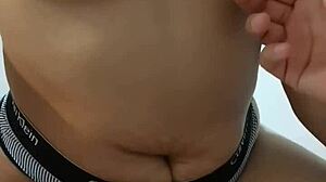Touching Her Navel During Handjob