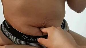 Touching Her Navel During Handjob