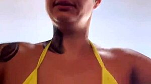 at the beach gym in transparent thong bikini piercing showing wet