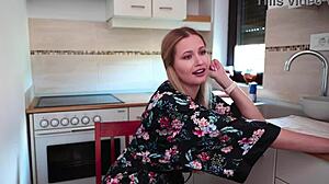 busty blonde babe strips masturbates toys by window