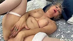 busty granny flaunts her perfect curves