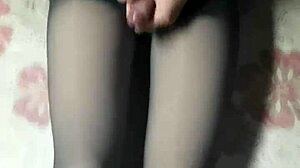 crossdresser strokes cock in pantyhose and tight jeans