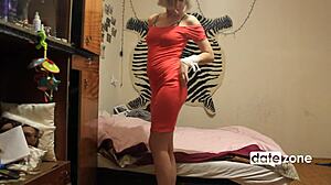 Short haired blonde fingers her pussy in tight red dress.