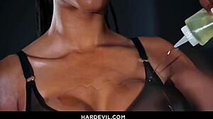 Kira Noir's ebony backside gets oiled up for a deep ride