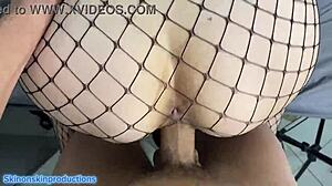 shaved redhead babe in fishnets flashes saggy tits... cum on her face now!