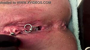 pierced clit milf rubs hard in latex gloves unleashing pee stream