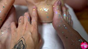 two leggy cuties stroke huge rubber cock with their shiny feet in lesbian footjob play