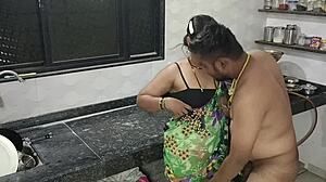 indian couple getting frisky with kitchen fun together