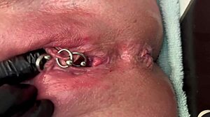 pierced clit milf rubs hard in latex gloves unleashing pee stream