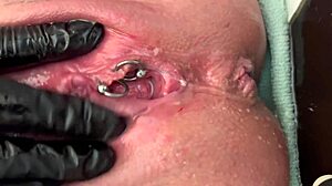 pierced clit milf rubs hard in latex gloves unleashing pee stream