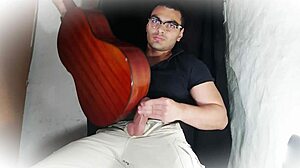 muscular stud jerks 18cm cock on guitar till cumshot