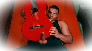 muscular stud jerks 18cm cock on guitar till cumshot