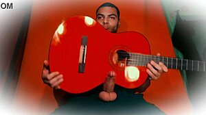 muscular stud jerks 18cm cock on guitar till cumshot