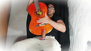 muscular stud jerks 18cm cock on guitar till cumshot