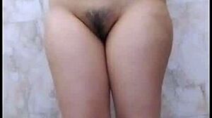 Chubby Indian girl whispers dirty talk while fingering her big tits in bathroom