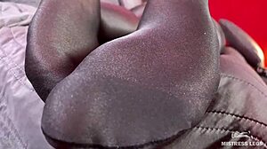 Anthracite nylon feet tease rubbing close to face