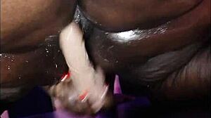 Ebony SSBBW spreads fat ass and squirts from huge dildo on table