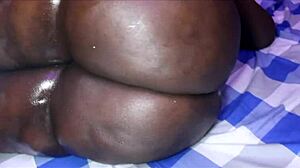 Ebony SSBBW spreads fat ass and squirts from huge dildo on table