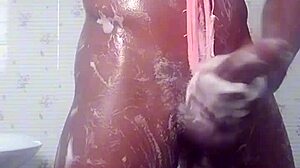 A black amateur babe soaps up her curves having fun in the shower