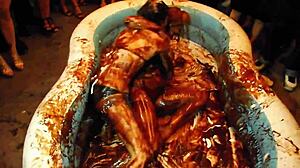 King Cures hosts chocolate model wrestling olympics by the pool