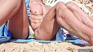 sporty couple strips naked for beach handjob and masturbation