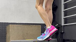 Muscular Brunette Works Out Wet Pussy in Gym Leg Spreads