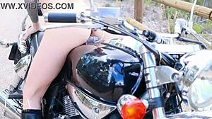 Skinny Latina rides dildo cowgirl on leather motorcycle outdoors
