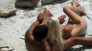 slim blonde strokes boyfriend while beach voyeur watches