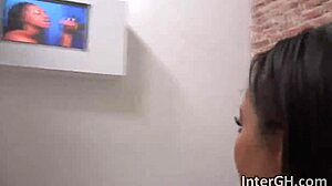 ebony babe deepthroats through glory hole bent over for interracial cock