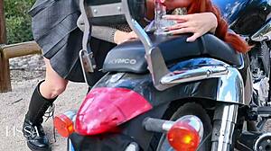 Skinny Latina rides dildo cowgirl on leather motorcycle outdoors