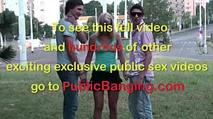 young blonde cutie takes two cocks in public street gangbang orgy