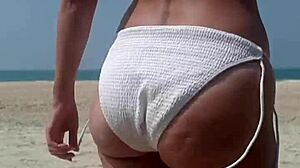 Peeing in White Bikini on Crowded Public Beach!