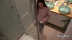 Why does busty Kecy linger naked in shower revealing natural big tits?