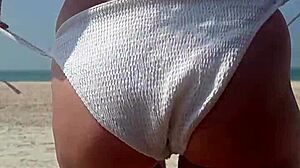 Peeing in White Bikini on Crowded Public Beach!