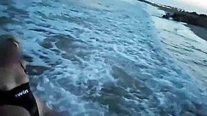 blonde flashes tits then deepthroats cock on crowded beach