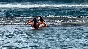 two sexy brazilians kiss big asses beachside