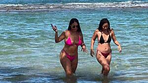 two sexy brazilians kiss big asses beachside