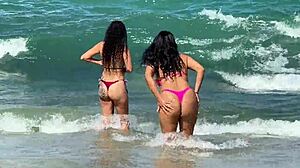 two sexy brazilians kiss big asses beachside