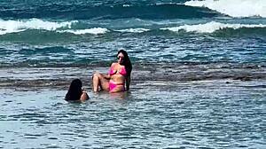 two sexy brazilians kiss big asses beachside