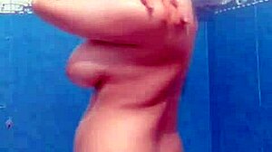Seductive milf wife caught on hidden bathroom cam fingering wet tits and ass