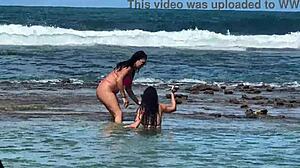 two sexy brazilians kiss big asses beachside