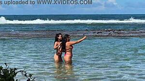 two sexy brazilians kiss big asses beachside