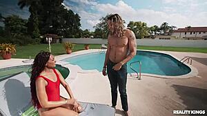 Sunbathing babe licks cock then rides it poolside!