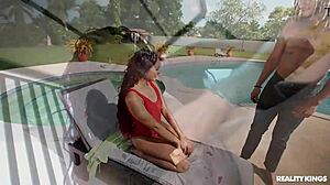 Sunbathing babe licks cock then rides it poolside!