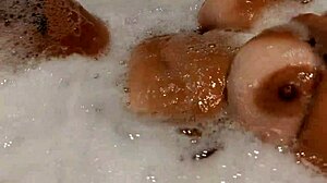 Tanned Stepsis Teases Big Tits and Pussy in Bathroom - Watch Her!