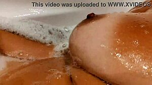 Tanned Stepsis Teases Big Tits and Pussy in Bathroom - Watch Her!